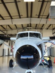 View of a twin otter from the nose in the hanger