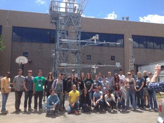 Participants from the 2016 FluxCourse pose in front of the NEON HQ flux tower. Accompanying article "Fluxcourse Students visit NEON Headquarters"