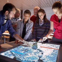 Stock photo of people looking at a map