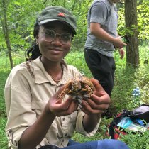 Student holds a turtle
