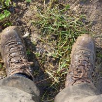 Field technician with muddy boots