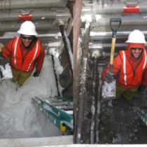 Field technician in snow pIt