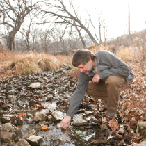 Man looking at stream 