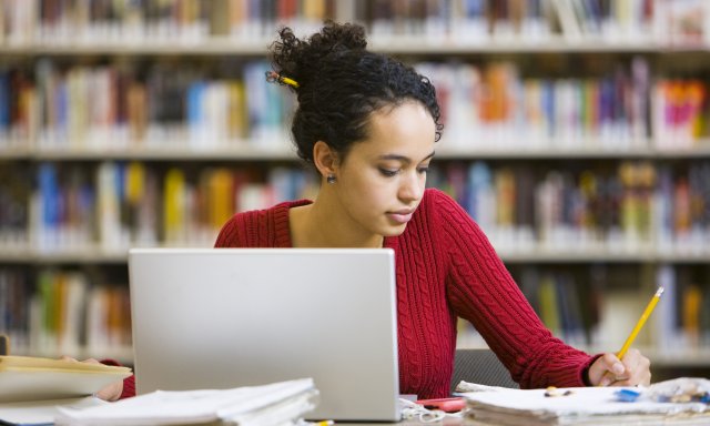 A researcher in a library (stock image)