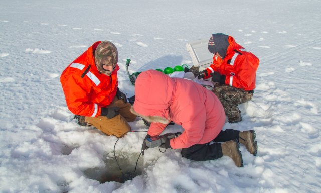 Field technicians sampling in the snow