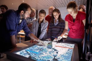 Stock photo of people looking at a map