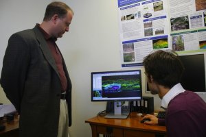 Jared Polis Views LiDAR data on a site tour