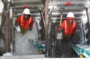 Field technician in snow pIt