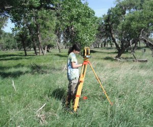 Field technician doing total station monitoring