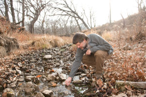 Man looking at stream 