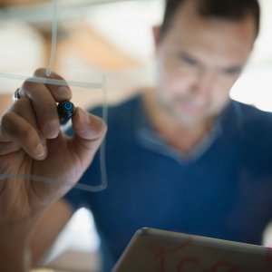 Man writing on board