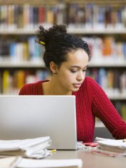 A researcher in a library (stock image)