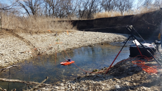 A Trimaran float equipped with an ADCP measuring discharge at the D06 MCDI stream site. 