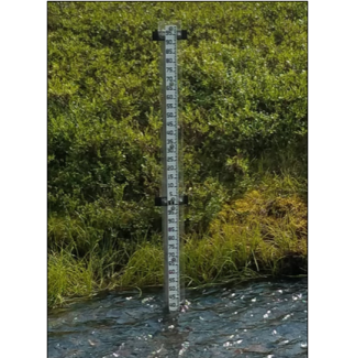 A staff gauge installed at a NEON aquatic site where water level is measured.   