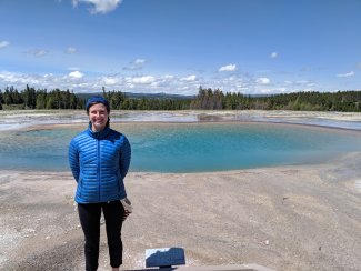 Anna Spiers in front of a hot spring