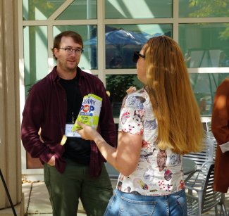 Max Glines talking with other people at the NEON Convergence Summit 