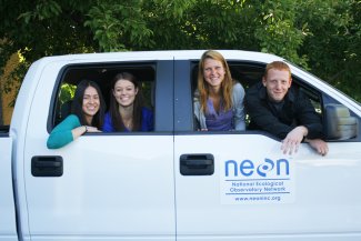 Group of NEON field staff in a field truck