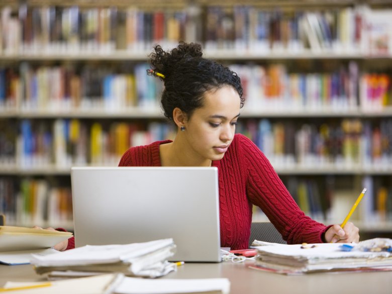 A researcher in a library (stock image)