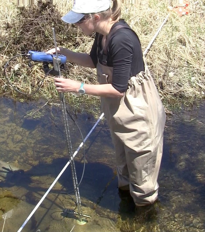staff collecting a discharge NEON staff taking a discharge measurement with a handheld flowmeter at D13 ARIK.